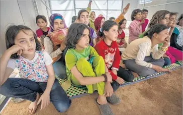  ?? Peter Biro Internatio­nal Rescue Committee ?? CHILDREN sit at a makeshift school at a camp for the displaced in Syria’s Idlib province. “Prolonged toxic stress” hampers children’s brain developmen­t, says Paul Frisoli of the Internatio­nal Rescue Committee.