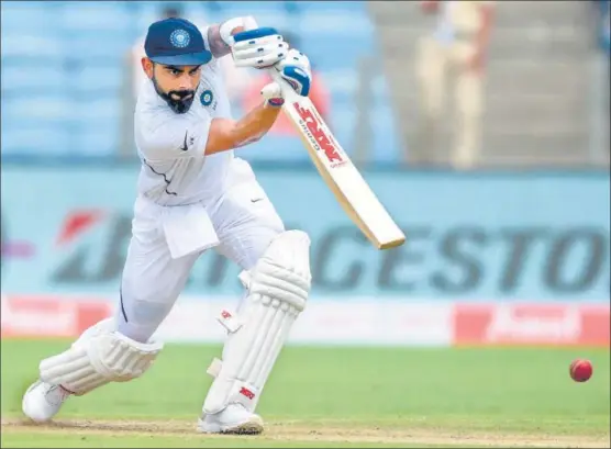  ?? AFP ?? ■ Going by the way Virat Kohli was middling the ball when he declared, he could have easily had a go at his maiden triple century. He didn’t. Nonetheles­s, records tumbled.