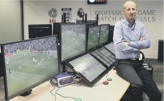  ??  ?? Referee Mike Riley in a Video Assistant Referee Hub set up for the FA, Premier League and EFL in London, containing the equipment to be used for reviews.