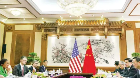  ?? — AFP ?? BEIJING: US National Security Advisor Susan Rice (left) takes part in talks with Chinese State Councilor Yang Jiechi (right) during their meeting at the Diaoyutai State Guesthouse.