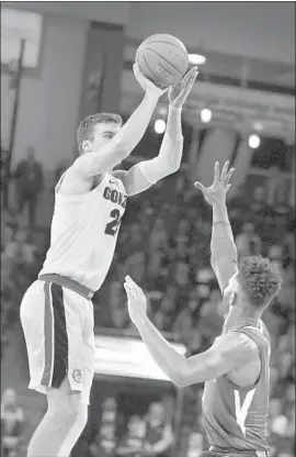  ?? Young Kwak Associated Press ?? GONZAGA FORWARD Corey Kispert shoots while being defended by Washington guard Jaylen Nowell. The Bulldogs won on a basket in the final second.