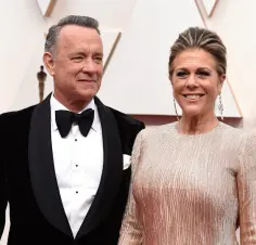  ??  ?? INFECTED: Tom Hanks and his wife Rita Wilson