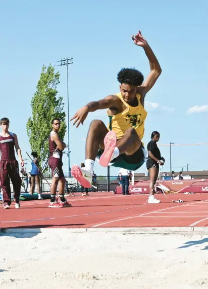  ?? AMY SHORTELL/THE MORNING CALL ?? Emmaus’ Kyle Moore improved on his area-best mark in the triple jump to capture EPC gold Tuesday at Whitehall.
