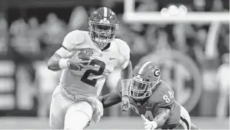  ?? Kevin C. Cox/Getty Images ?? Hurts bounced back from being benched at halftime in Alabama’s eventual CFP title game win over Georgia five years ago, becoming a Heisman finalist at OU and an MVP finalist in Philly.