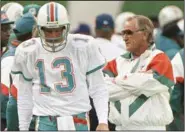  ?? (AP/Bill Kostroun) ?? Legendary Miami Dolphins Coach Don Shula (right) talks with quarterbac­k Dan Marino during a 1992 game against the New York Jets. Shula, who died Monday at age 90, coached the Dolphins for 26 seasons and guided them to two Super Bowl titles.