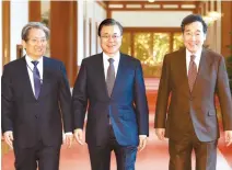  ?? Yonhap ?? President Moon Jae-in, center, heads to a Cabinet meeting with his chief of staff Noh Young-min, left, and Prime Minister Lee Nak-yon, at Cheong Wa Dae, Tuesday.