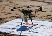  ?? Westpac Little Ripper via Associated Press ?? A drone dropped a flotation device to two teens caught in a riptide off the Australian coast Thursday in what officials are describing as a world-first rescue.