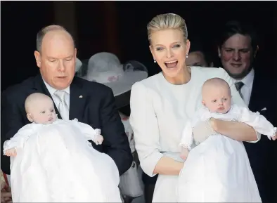  ?? PICTURE: SEBASTIEN NOGIER / EPA ?? JOYFUL OCCASION: Prince Albert II of Monaco and his wife, Princess Charlene, hold their twins, Princess Gabriella and Prince Jacques, after their baptism ceremony at the Cathedral of Monaco yesterday. Jacques, hereditary Prince of Monaco, is now first...