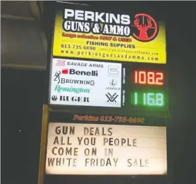  ?? LANCE PERKINS/FACEBOOK ?? Lance Perkins posted a sign advertisin­g a “White Friday sale” outside of his Pembroke, Ont., gun shop. It has nothing to do with anyone’s skin colour, he says.