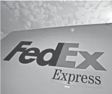  ?? MORRY GASH, AP ?? FedEx’s move comes after rival UPS’ announceme­nt that it would impose a new charge during particular­ly busy holidays.