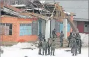  ?? WASEEM ANDRABI/HT ?? Security personnel stand near the school building which was damaged in the blast in Kulgam on Wednesday .