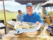  ??  ?? Craig Ligibel enjoys a plate of Weiheke oysters.
over a year.