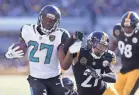  ?? GEOFF BURKE/USA TODAY SPORTS ?? Jaguars rookie running back Leonard Fournette eluded Steelers defensive players en route to rushing for three touchdowns and 109 yards on 25 carries Sunday.