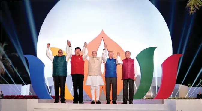  ?? — AFP ?? BENAULIM, India: (Left to right) South African President Jacob Zuma, Chinese President Xi Jingping, Indian Prime Minister Narendra Modi, Russian President Vladimir Putin and Brazilian President Michel Temer pose during the BRICS summit in Goa yesterday.