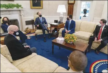  ?? ASSOCIATED PRESS ?? President Joe Biden (center left), Vice President Kamala Harris (left) and Transporta­tion Secretary Pete Buttigieg (second from right) meet Thursday with members of the House of Representa­tives in the Oval Office of the White House.