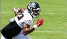  ?? HYOSUB SHIN / HYOSUB.SHIN@AJC.COM ?? Falcons rookie safety Jaylinn Hawkins runs though a drill Tuesday at training camp in Flowery Branch.