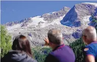  ?? LUCA BRUNO/ASSOCIATED PRESS ?? A chunk of an Alpine glacier in Italy broke off, sending an avalanche of ice, snow and rocks down the slope, burying hikers. Officials say seven people are known to be dead.