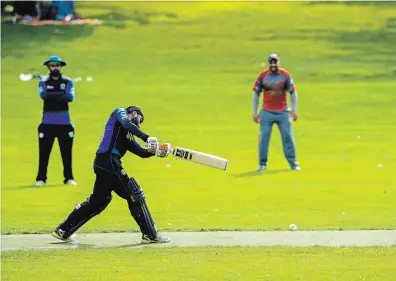  ?? ANDREJ IVANOV WATERLOO REGION RECORD ?? Above: Thwack! A leather ball hits a willow bat during a game of cricket in Waterloo Park in Waterloo this weekend.