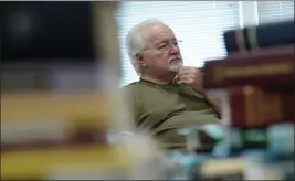  ?? SUSAN WALSH — THE ASSOCIATED PRESS FILE ?? Paul Phelps, 76, of Alexandria, Va., works in the genealogy room at Hollin Hall Senior Center in Alexandria, Va., on Thursday.