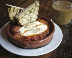  ?? PHOTO COURTESY OF DAVID REAMER ?? When Portland’s Tasty n Sons put Shakshuka, a poached egg and tomato- pepper brunch dish, on the menu, they launched cravings up and down the West Coast.