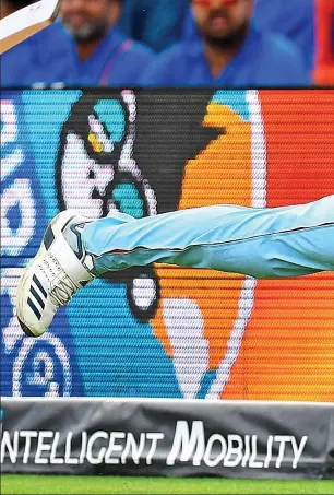  ??  ?? Grab: all-rounder Chris Woakes is at full stretch on the deep midwicket boundary as he hangs on to the vital catch which dismissed the dangerous Pant