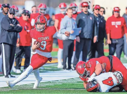  ?? Carl Albert quarterbac­k Kevin Sperry Jr. (9) finds running room against Del City in the Class 5A football state championsh­ip game on Dec. 2 at Chad Richison Stadium in Edmond. NATHAN J. FISH/THE OKLAHOMAN ??