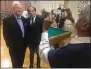  ?? RICH FREEDMAN — TIMES-HERALD ?? Ravi Shankar takes a photo of Solano County Supervisor candidate Robert McConnell and former Vallejo school trustee Ruscal Cayangyang at Tuesday night’s gathering at Redmen’s Hall.