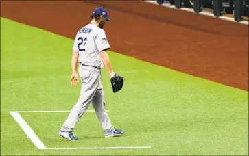  ?? Wally Skalij Los Angeles Times ?? CLAYTON KERSHAW comes out in the sixth inning after holding the Rays to two runs on f ive hits while striking out six. He won for the second time in the Series, moving L. A. within a win of the championsh­ip.