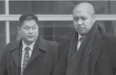  ?? TANNIS TOOHEY/TORONTO STAR FILE PHOTO ?? Constables Edward Ing, left, and John Cruz, after they were found guilty of assault causing bodily harm last year. That ruling has been quashed.