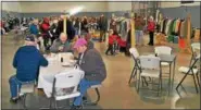  ?? SUBMITTED PHOTO - SALEM EC ?? Bargain hunting through tables of items at Salem EC Church’s annual Yard Sale in 2017. This year’s event is planned for March 2 and 3, rain or shine, at the church, 2150 Old 22, Lenhartsvi­lle.