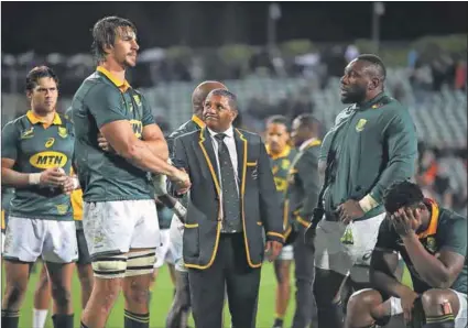  ??  ?? Tall order: Alister Coetzee consoles Springbok captain Eben Etzebeth after the drubbing by the All Blacks. The Boks are under extreme pressure to excel against the Wallabies on Saturday. Photo: Phil Walter/Getty Images