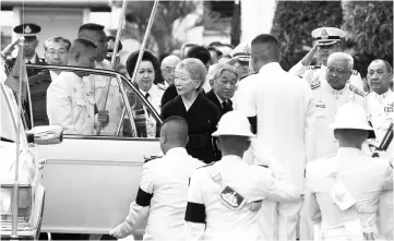  ??  ?? Akihito and Michiko arrive at the throne hall at the Grand Palace to pay respects to the late King Bhumibol. — Reuters photo