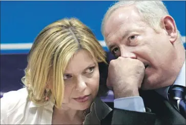  ?? Gali Tibbon AFP/Getty Images ?? ATTORNEYS for Sara Netanyahu, pictured with husband Benjamin Netanyahu in 2006, said that the charges against her are “baseless” and that it is “far-fetched that a leader’s spouse is being indicted over takeout.”