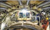  ?? XINHUA ?? Chinese workers operate a shield tunneling machine at a light-rail constructi­on site in Tel Aviv, Israel.