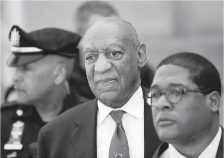  ?? PHOTOS BY MATT SLOCUM, THE ASSOCIATED PRESS ?? Bill Cosby, centre, leaves the Montgomery County Courthouse in Norristown, Pennsylvan­ia, after being convicted of drugging and molesting a woman.