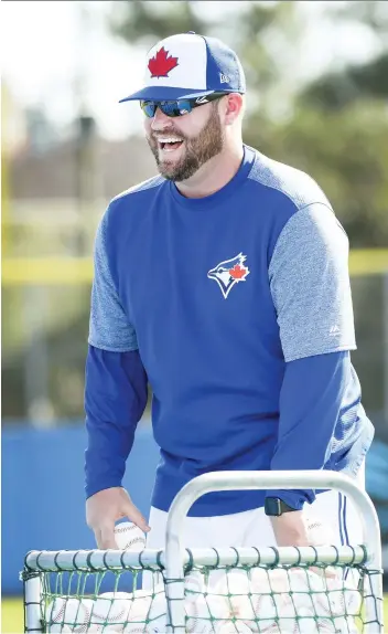 ?? PHOTOS: NATHAN DENETTE/THE CANADIAN PRESS ?? Toronto Blue Jays coach John Schneider says he is excited to be a member of a major-league staff for the first time after managing in double-A last season.