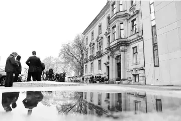  ??  ?? Police and members of the media are pictured outside the German Parliament­ary Society in Berlin, Germany. — Reuters photo