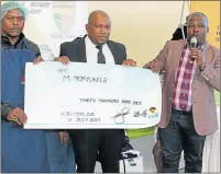  ?? Picture: SUPPLIED ?? ON BOARD: Councillor Nzuzo Mquqo stands with Melikhaya Nonyukela and mayor Minkelo Siwisa during the official handover