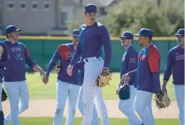  ?? E. JASON WAMBSGANS/CHICAGO TRIBUNE ?? Hayden Wesneski and other Cubs pitchers work on pick-off drills on Feb. 23 at Sloan Park in Mesa, Ariz.