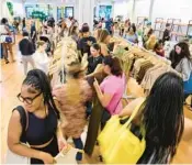  ?? COOPER NEILL/THE NEW YORK TIMES ?? Customers lined up at 6 a.m. Aug. 26 to shop the Shein pop-up in Plano, Texas.