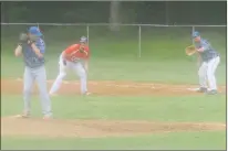  ?? STAFF PHOTO BY TED BLACK ?? Cubs pitcher Zach O’Dell glances over his shoulder to check the runner on first as first baseman Ian Caballero awaits a potential throw. O’Dell blanked Western Charles on five hits as the Cubs prevailed 1-0 in their CHASM twinbill opener on Saturday.