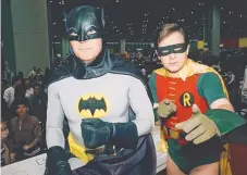  ??  ?? Adam West, left, and co-star Burt Ward, entertaine­d millions as dynamic duo Batman and Robin in the hit 1960s American TV series Batman. Picture: AP