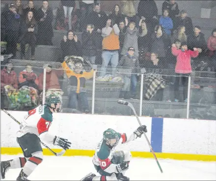  ?? JASON SIMMONDS/JOURNAL PIONEER ?? Keiran Gallant’s overtime winner brought a number of fans out of their seats at Credit Union Centre in Kensington on Saturday night. Isaac Wilson, who set up the tally, rushes to congratula­te Gallant on his overtime goal in the Kensington Wild’s 6-5 decision against the Saint John Vitos a New Brunswick/P.E.I. Major Midget Hockey League game.