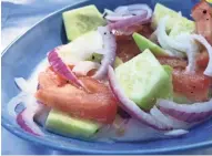  ?? KRISTINE M. KIERZEK ?? Cucumbers, tomatoes and onions combine in this simple garden salad, a recipe from Sandra Webb's family.