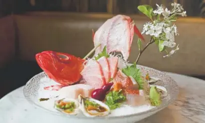  ?? Photos by Amy Brothers, The Denver Post ?? Above, the Sashimi plate off the special menu includes Kinmedai (golden eye snapper), Bluefin Otoro (fatty bluefin tuna), Hamaghi (yellow tail) and Kumfmoto oysters. At top, Wagyu beef hot stone.