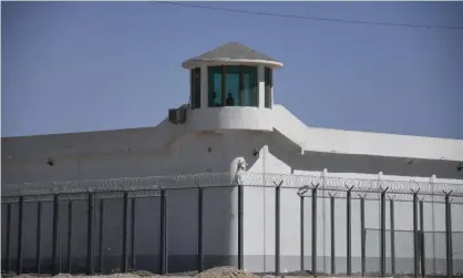  ??  ?? This file photo taken on 31 May 2019 shows a watchtower on a high-security facility near what is believed to be a re-education camp where mostly Muslim ethnic minorities are detained, on the outskirts of Hotan, in Xinjiang region. Photograph: Greg Baker/AFP/Getty Images