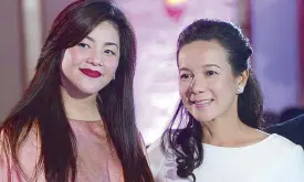  ??  ?? Regine Velasquez (with Grace) who rendered two songs with husband Ogie Alcasid