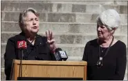  ?? JOHN HANNA/ASSOCIATED PRESS ?? Former Kansas Democratic Party Chair and state Revenue Secretary Joan Wagnon, left, speaks during a rally for a new group, Keep Kansas Free, while former Insurance Commission­er Sandy Praeger, right, a Republican, watches on Thursday, Oct. 13, 2022, outside the statehouse in Topeka, Kan. The group formed to urge voters who support abortion rights to back like-minded candidates and retain Kansas Supreme Court justices on the bench as ways to protect abortion access.