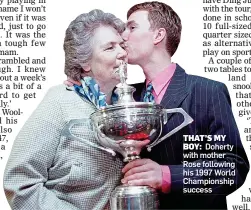  ??  ?? THAT’S MY
BOY: Doherty with mother Rose following his 1997 World Championsh­ip success