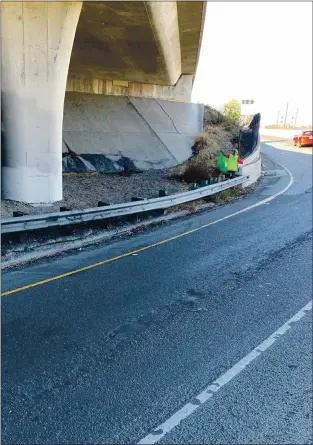  ?? COURTESY ?? A volunteer holds up A BAG of trash picked up under An overpass Along Interstate 280. Biweekly Cleanups organized By Willow Glen resident Thomas Holden have Attracted As many As 19 volunteers. Holden has scheduled Another Cleanup event for JAN. 10, After SANTA CLARA County’s “shelter in place” order is scheduled to Be lifted.